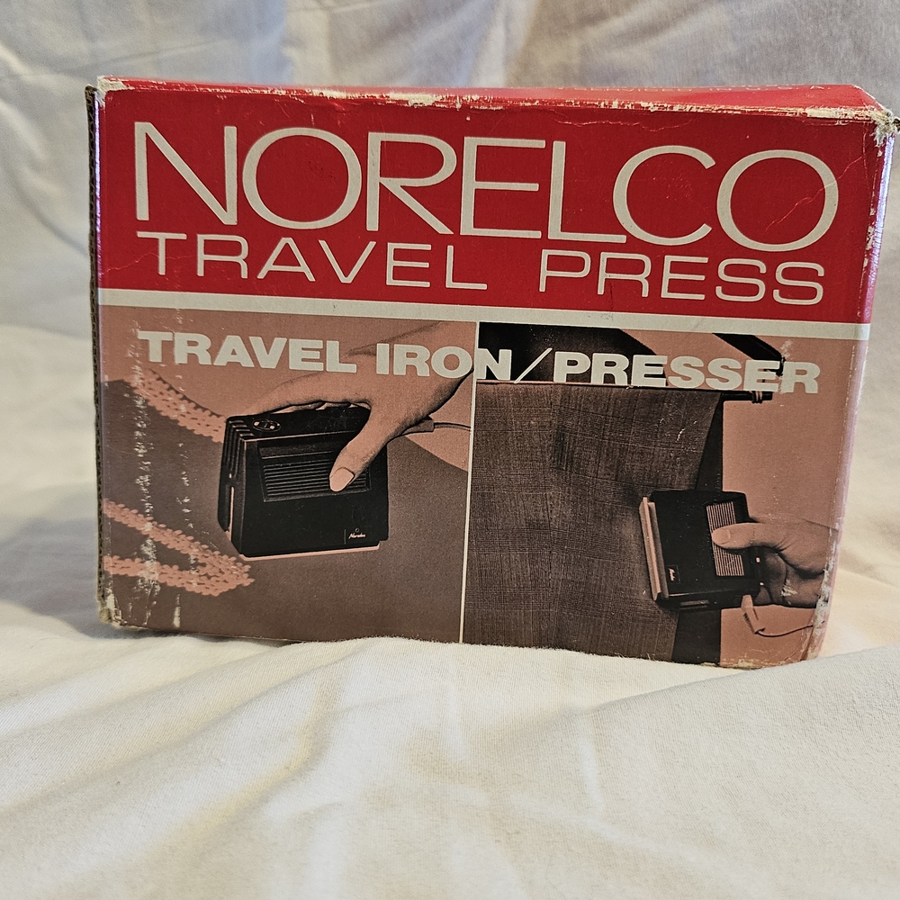Norelco Travel Iron/Presser in Red and Black